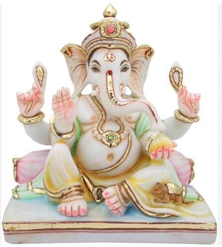 A detailed statue of the Hindu god Ganesha, showcasing his elephant head and intricate decorations.