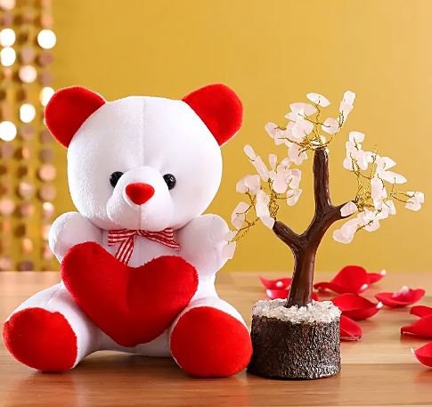 A cute teddy bear with a heart next to a small tree, representing affection and the beauty of the natural world.