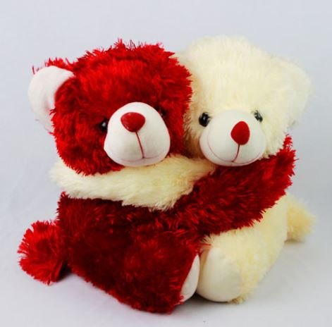 A heartwarming scene of two teddy bears hugging on a white background, representing love and companionship.