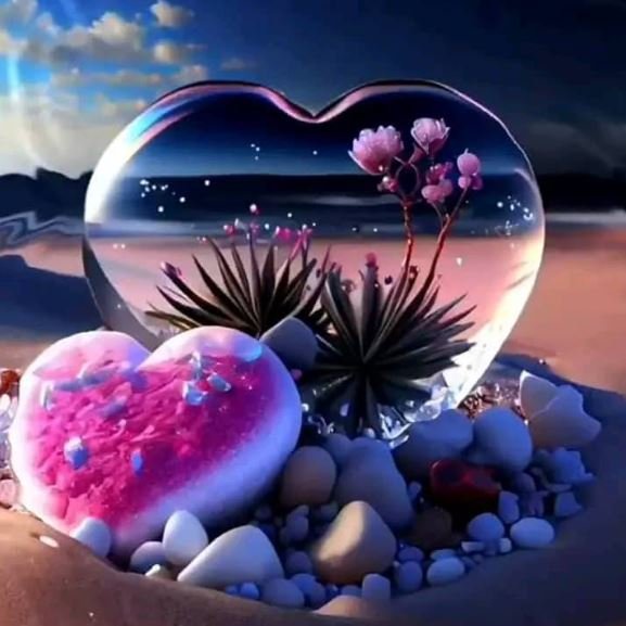 A heart-shaped glass adorned with pink flowers and pebbles, presenting a lovely and artistic floral composition.