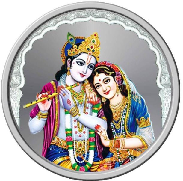 A round silver coin featuring the intricate depiction of Radha and Krishna in a harmonious embrace.