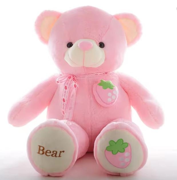 A cute pink teddy bear adorned with a strawberry on its chest, symbolizing sweetness and affection.